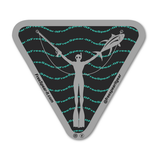 Free Spear-It Iconic Waves 4-Inch Holographic Sticker featuring a sleek silhouette of a freedive spearfisher holding a speargun and fish. The bold design includes wave-like Free Spear-It text lines in teal against a black background with a metallic grey border. The website FreeSpear-It.com and social media handle @freespearitgear are printed in the border of the sticker.
